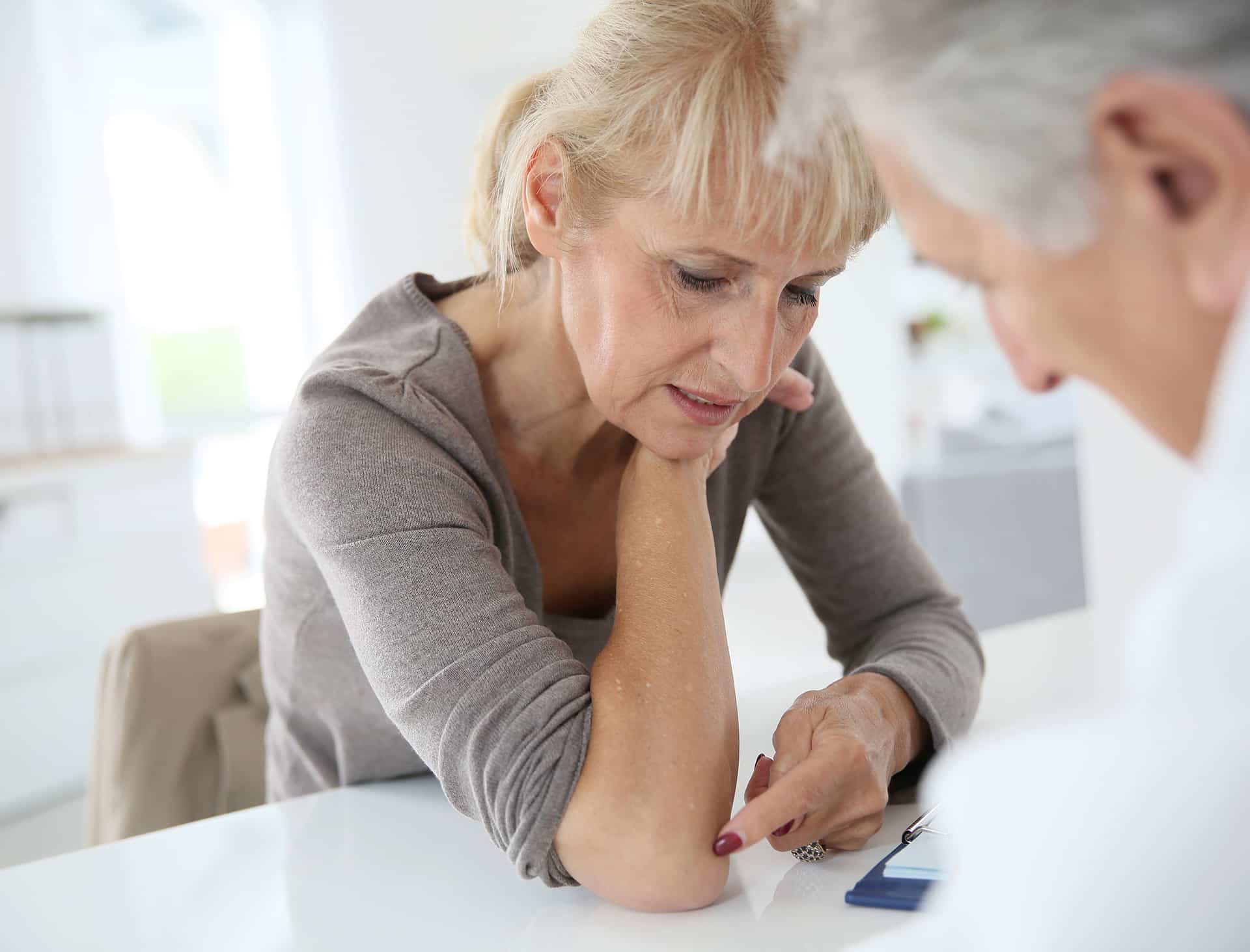 man and woman financing their dermatology appointment in rocklin ca