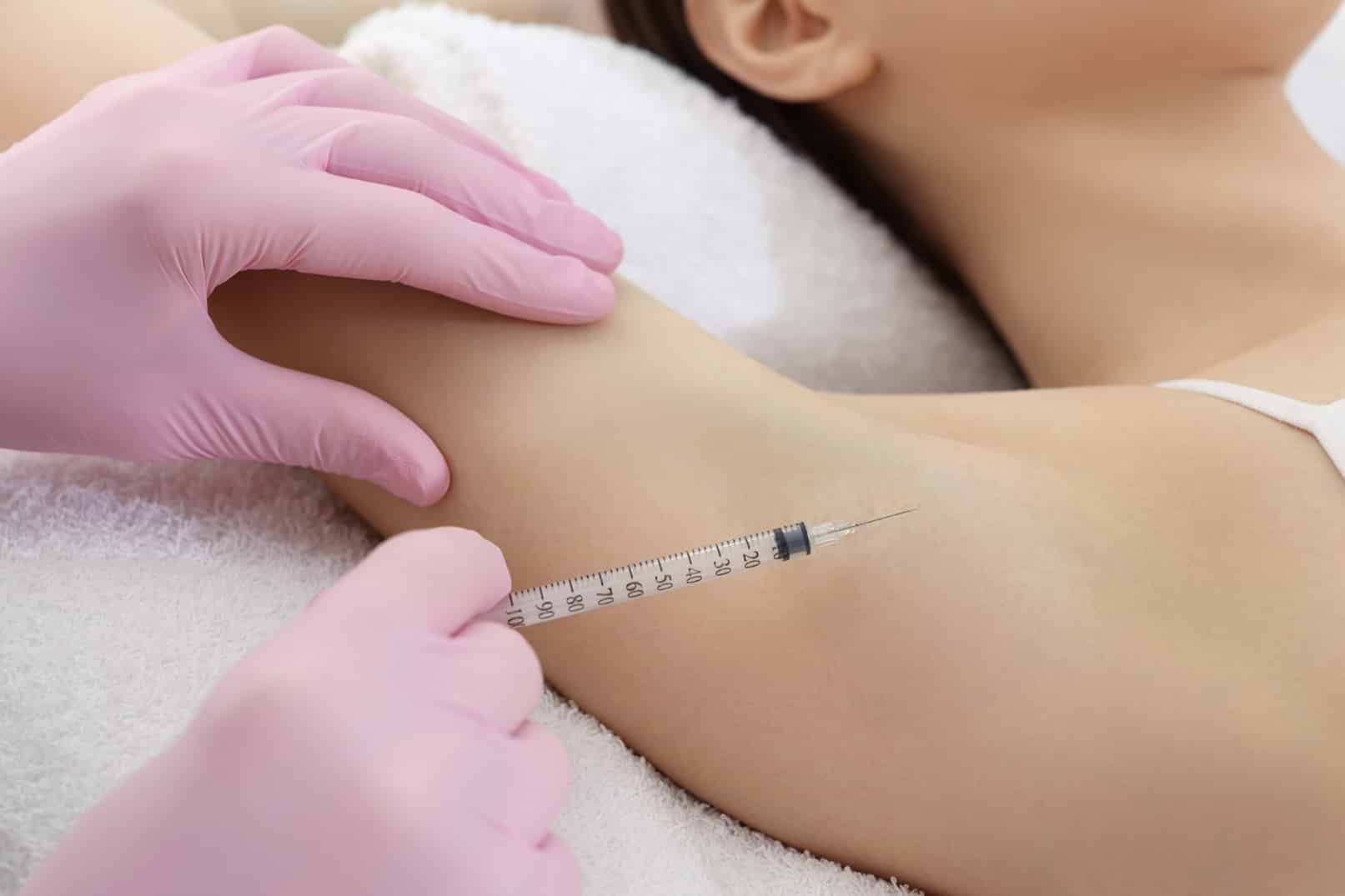 dr chacon injecting young woman's armpit during Treatment of hyperhidrosis